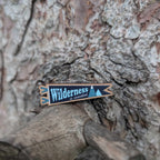 Wilderness is Essential wooden pin (black version)