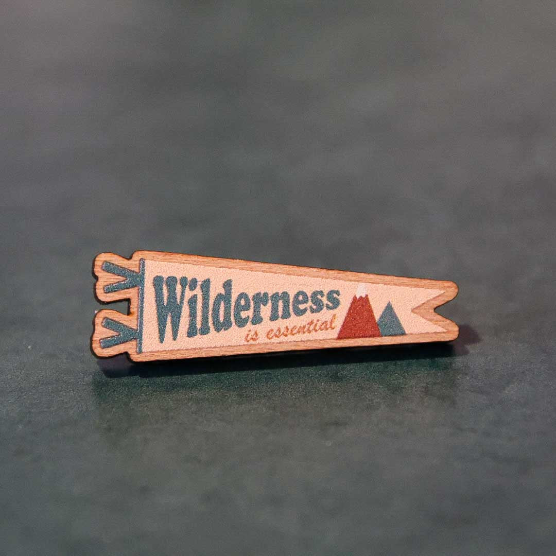 Wilderness is Essential wooden pin (cream version)