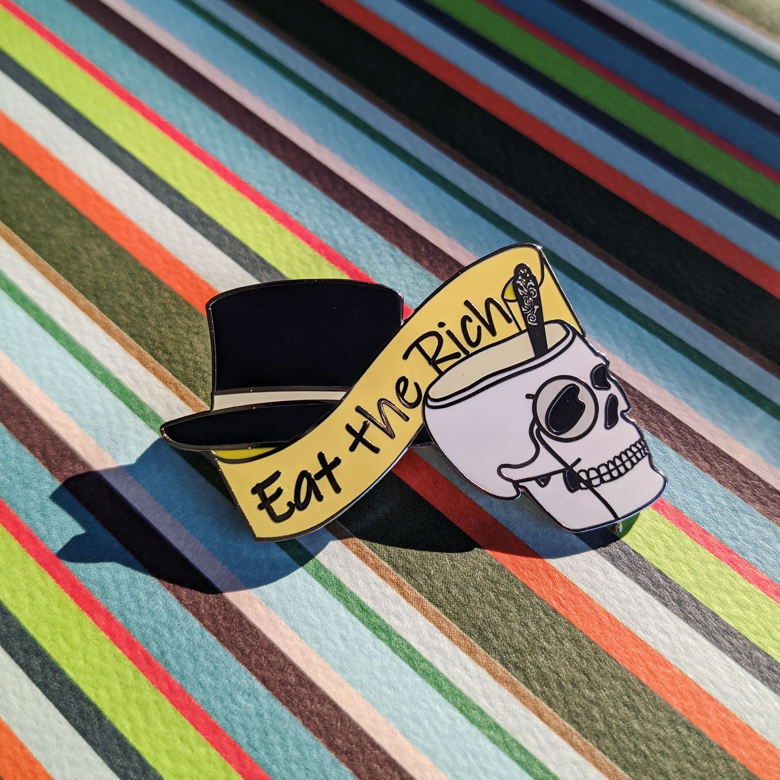 Eat the Capitalists hard enamel pin